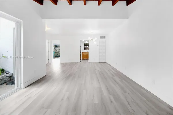 a view of a livingroom with wooden floor