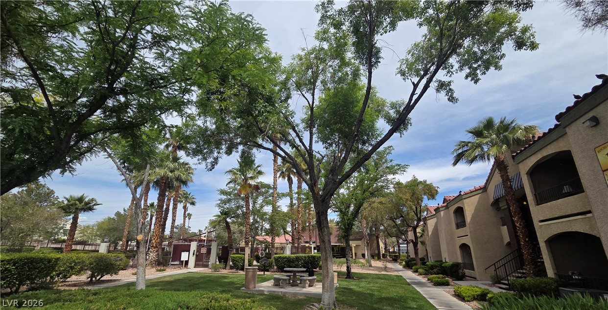 7885 West Flamingo Road, Unit 1008 Las Vegas, NV 89147 - Photo 26 of 29 Lush landscaping and mature trees create a serene environment around these inviting residences.
