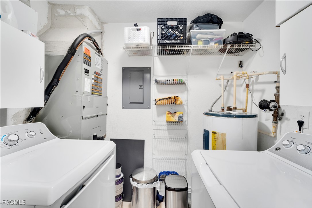 6450 Aragon Way, Unit 202 Fort Myers, FL 33966 - Photo 12 of 24 a bathroom with a sink a toilet and mirror