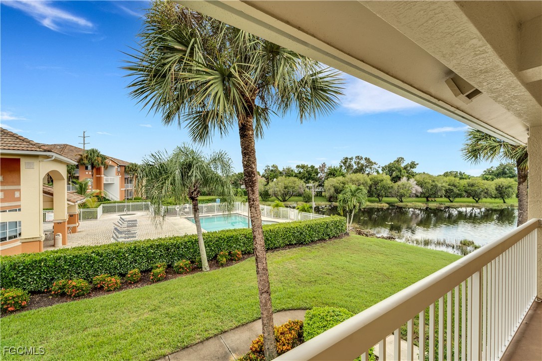 6450 Aragon Way, Unit 202 Fort Myers, FL 33966 - Photo 13 of 24 a view of a lake with a garden