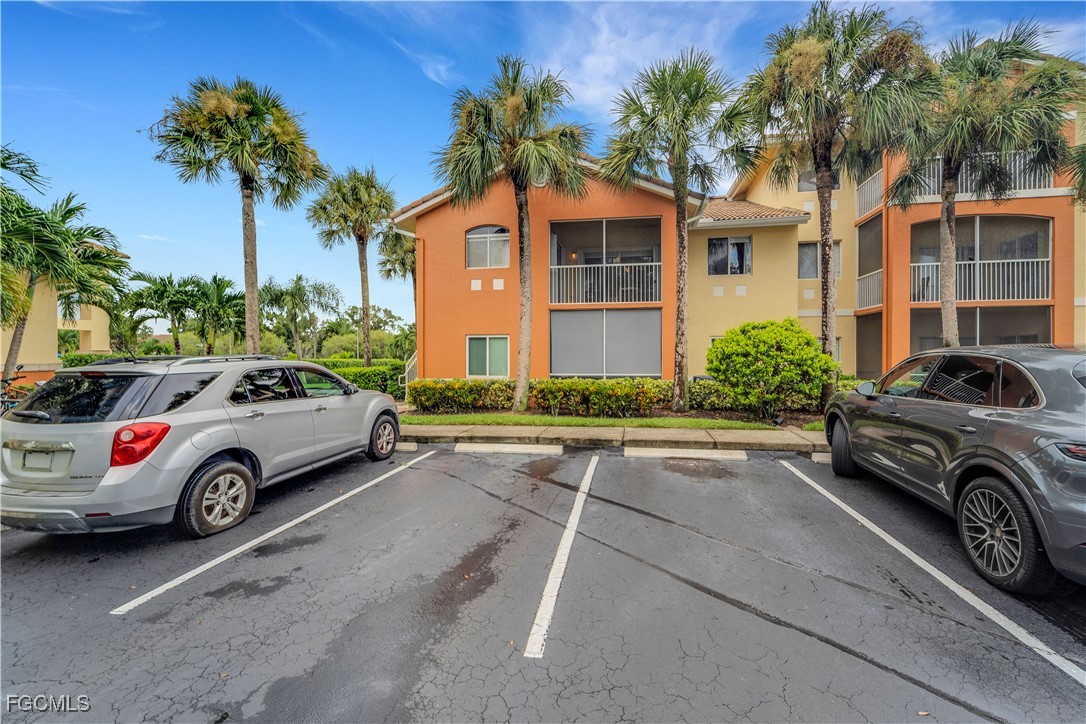 6450 Aragon Way, Unit 202 Fort Myers, FL 33966 - Photo 14 of 24 a car parked in front of a house