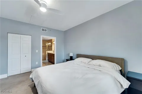 a large bed sitting in a bedroom and closet
