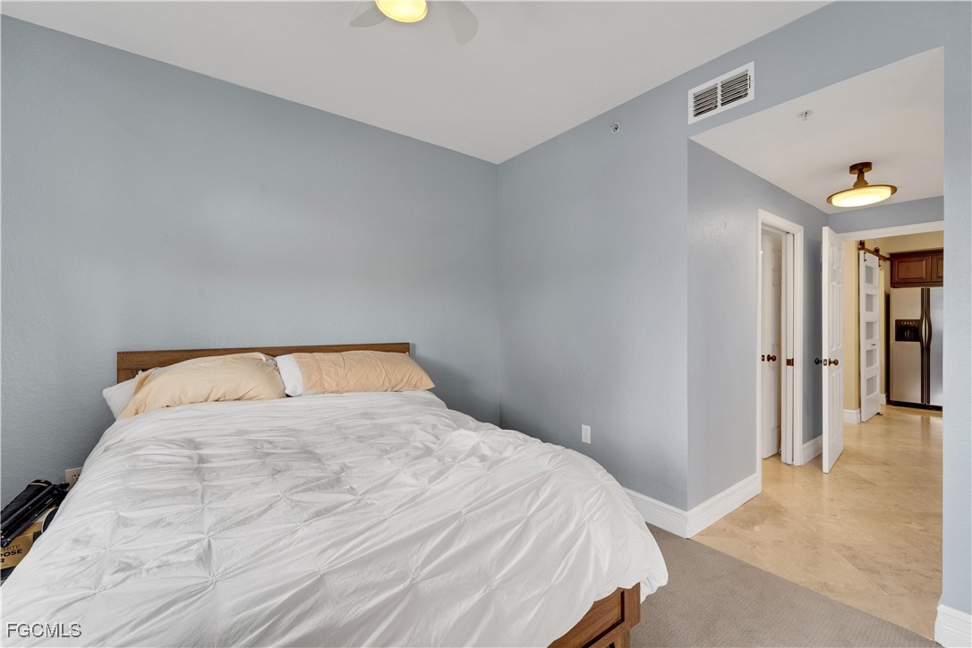 6450 Aragon Way, Unit 202 Fort Myers, FL 33966 - Photo 24 of 24 a bedroom with a bed and a window