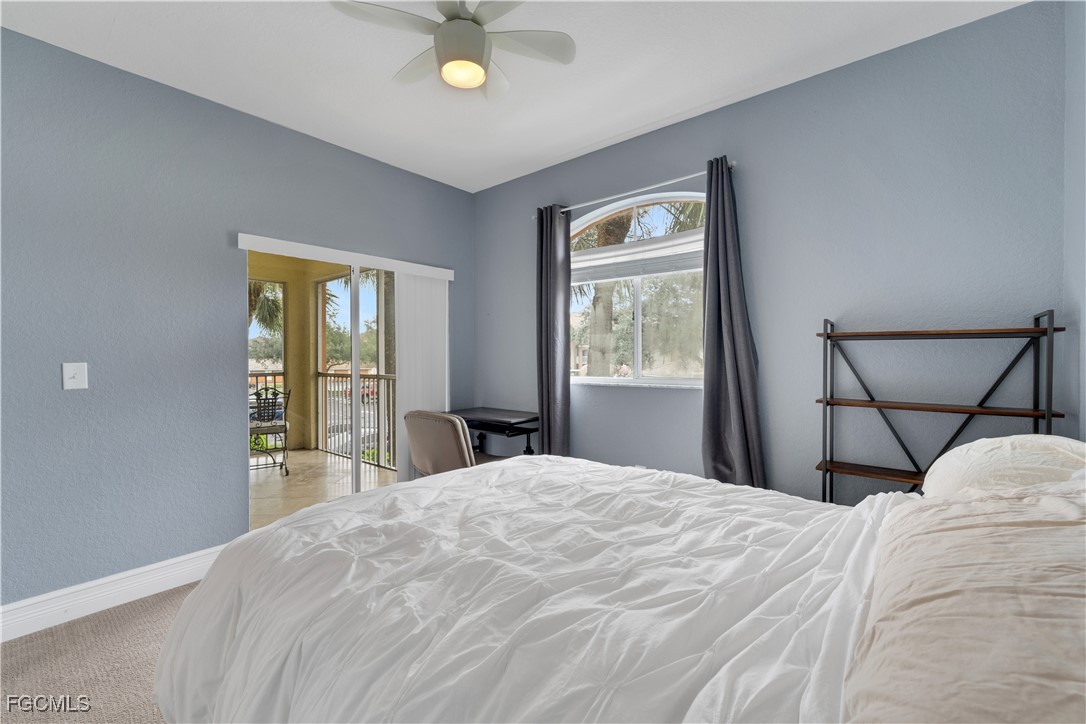 6450 Aragon Way, Unit 202 Fort Myers, FL 33966 - Photo 9 of 24 a bedroom with a large bed and a window