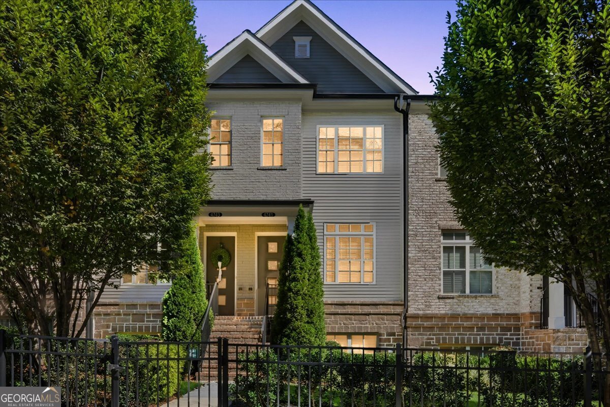 4741 Roswell Road Sandy Springs, GA 30342 - Photo 1 of 1 a front view of a house with a yard