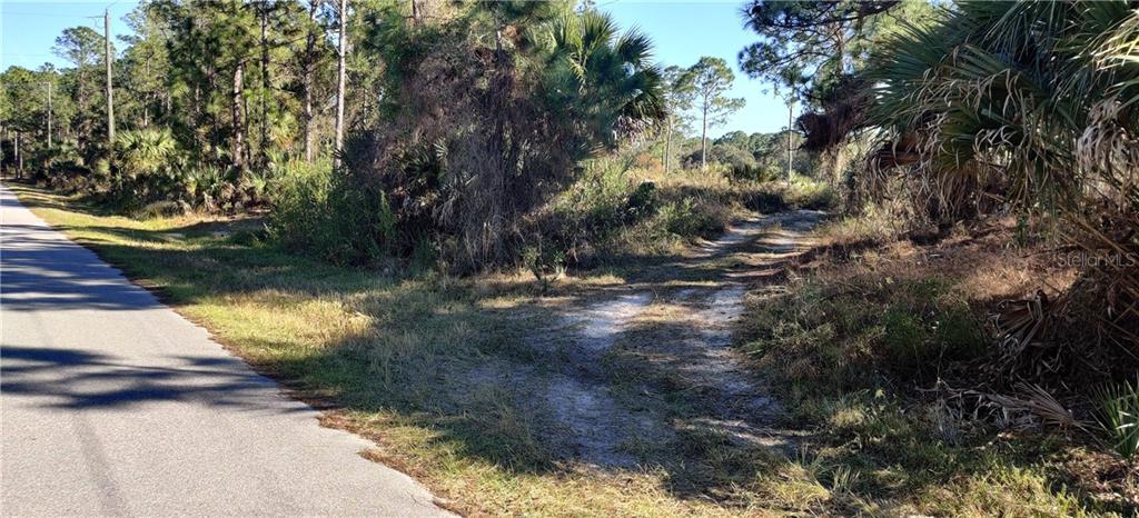 0 Van Eck Road North Port, FL 34291 - Photo 1 of 1 Front of lot at northwest corner.