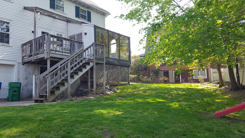 80 Rowena Road Newton, MA 02459 - Photo 7 of 7 a view of a house with a big yard potted plants and large tree