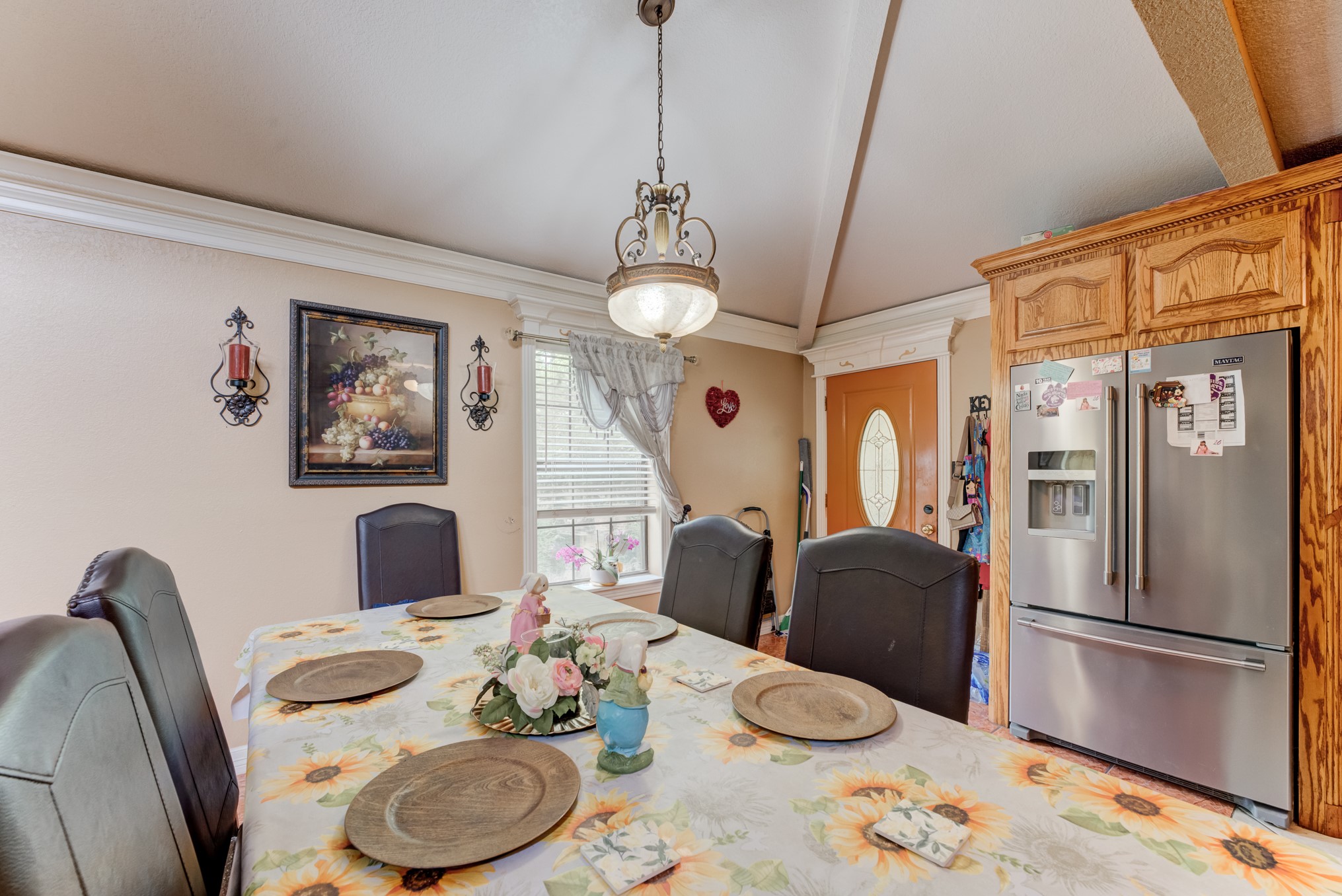 316 Hickman Lane Angleton, TX 77515 - Photo 16 of 48 a kitchen with stainless steel appliances granite countertop a dining table and chairs