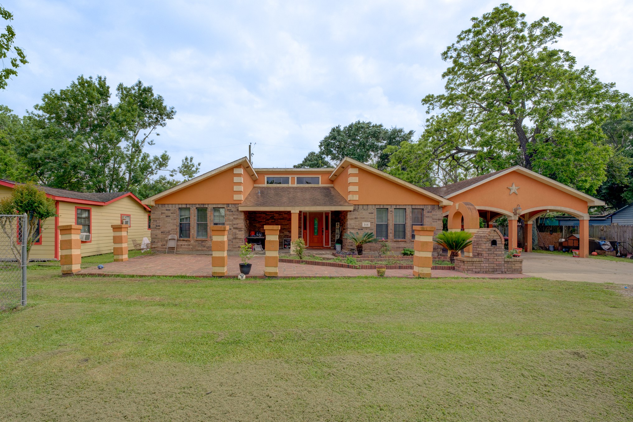 316 Hickman Lane Angleton, TX 77515 - Photo 2 of 48 a front view of a house with a yard