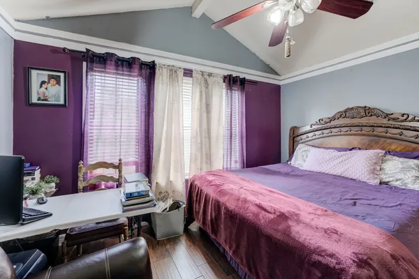 a bathroom with a sink a toilet and shower curtain