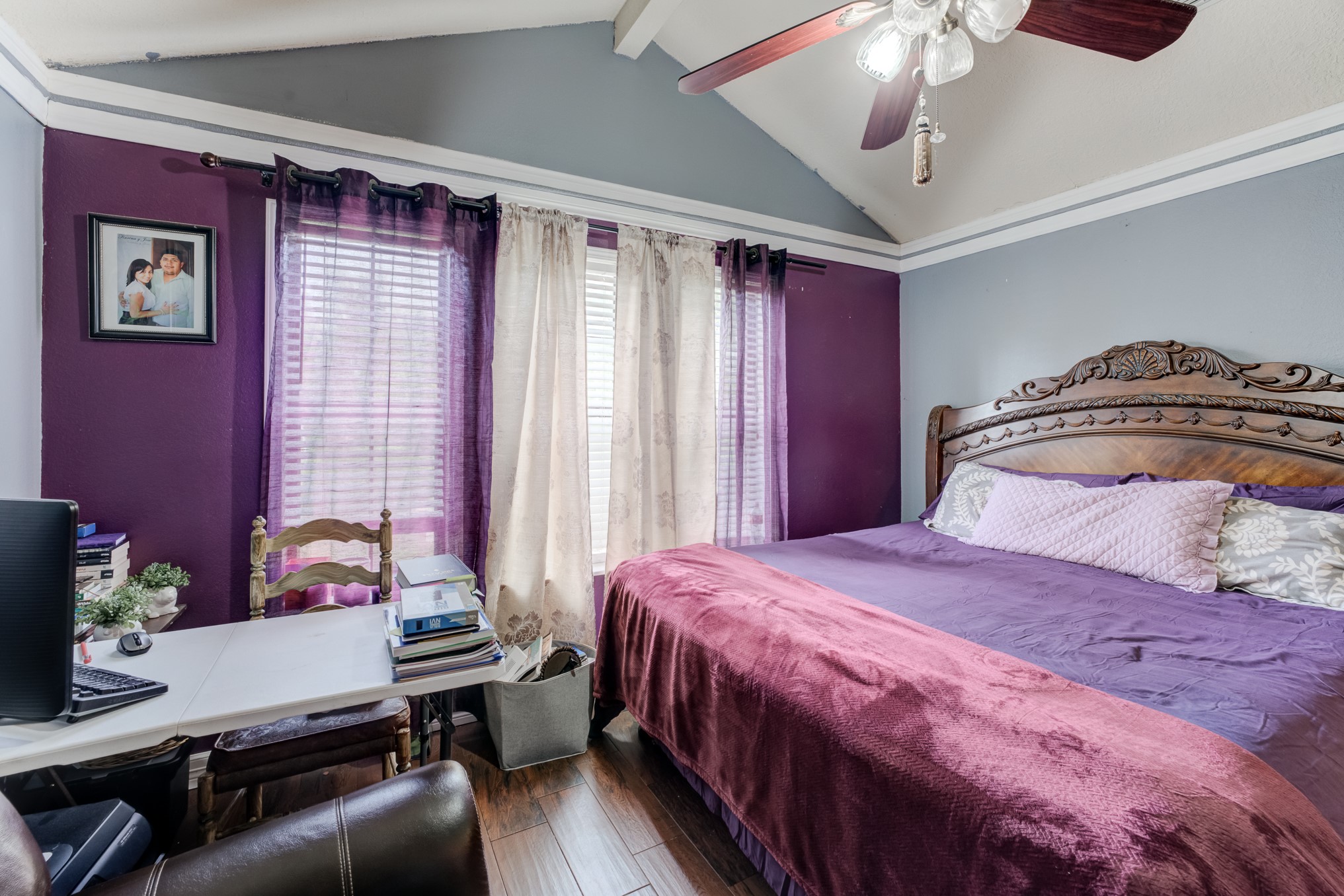 316 Hickman Lane Angleton, TX 77515 - Photo 21 of 48 a bedroom with a bed and a chandelier