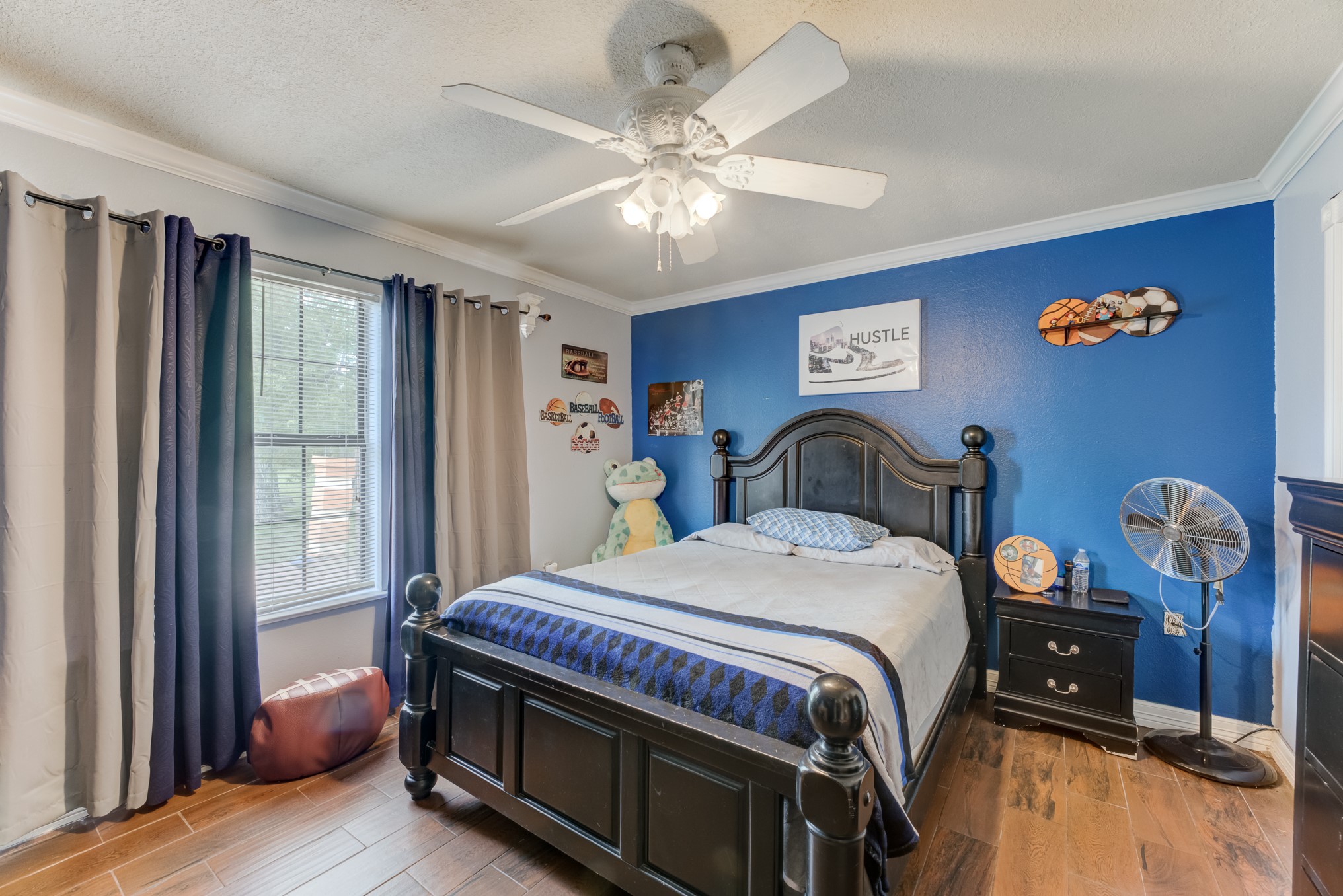 316 Hickman Lane Angleton, TX 77515 - Photo 24 of 48 a bedroom with a bed and a chandelier