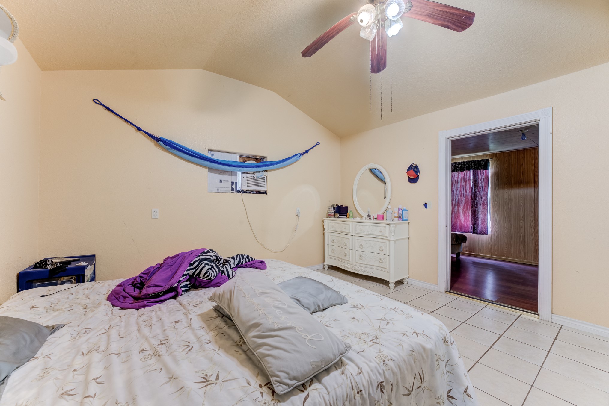 316 Hickman Lane Angleton, TX 77515 - Photo 29 of 48 a bedroom with a bed and a chandelier