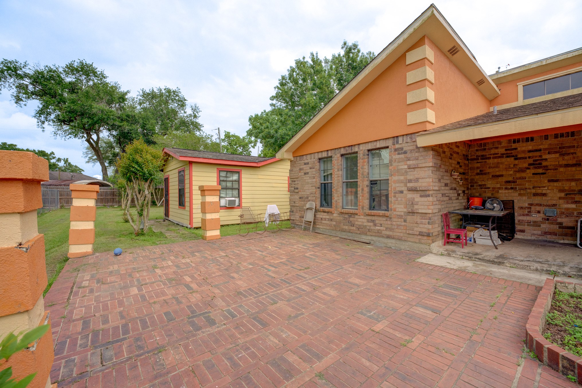 316 Hickman Lane Angleton, TX 77515 - Photo 3 of 48 a view of a house with backyard and a tree