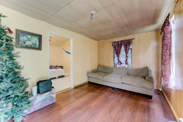a kitchen with stainless steel appliances a stove a sink cabinets and a window