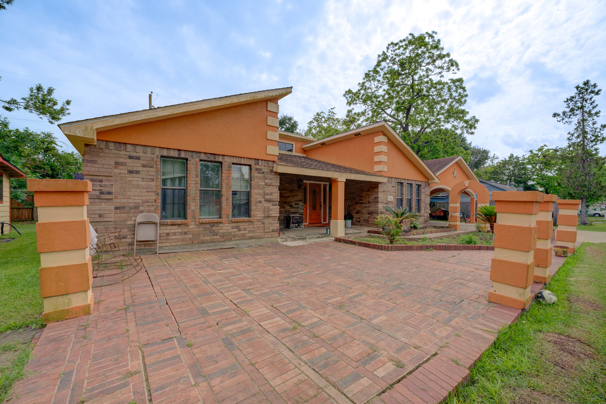 316 Hickman Lane Angleton, TX 77515 - Photo 42 of 48 a front view of a house with a yard and garage