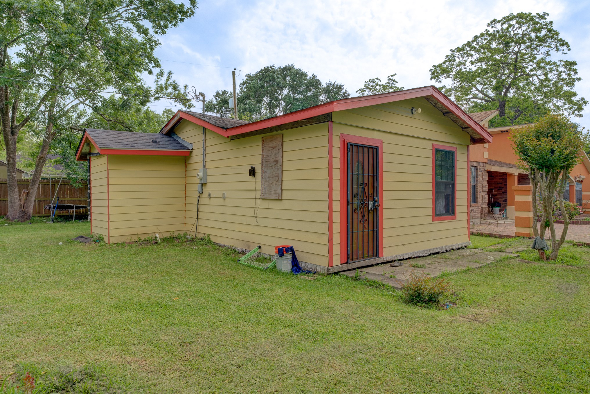 316 Hickman Lane Angleton, TX 77515 - Photo 44 of 48 a view of a backyard with a cabin