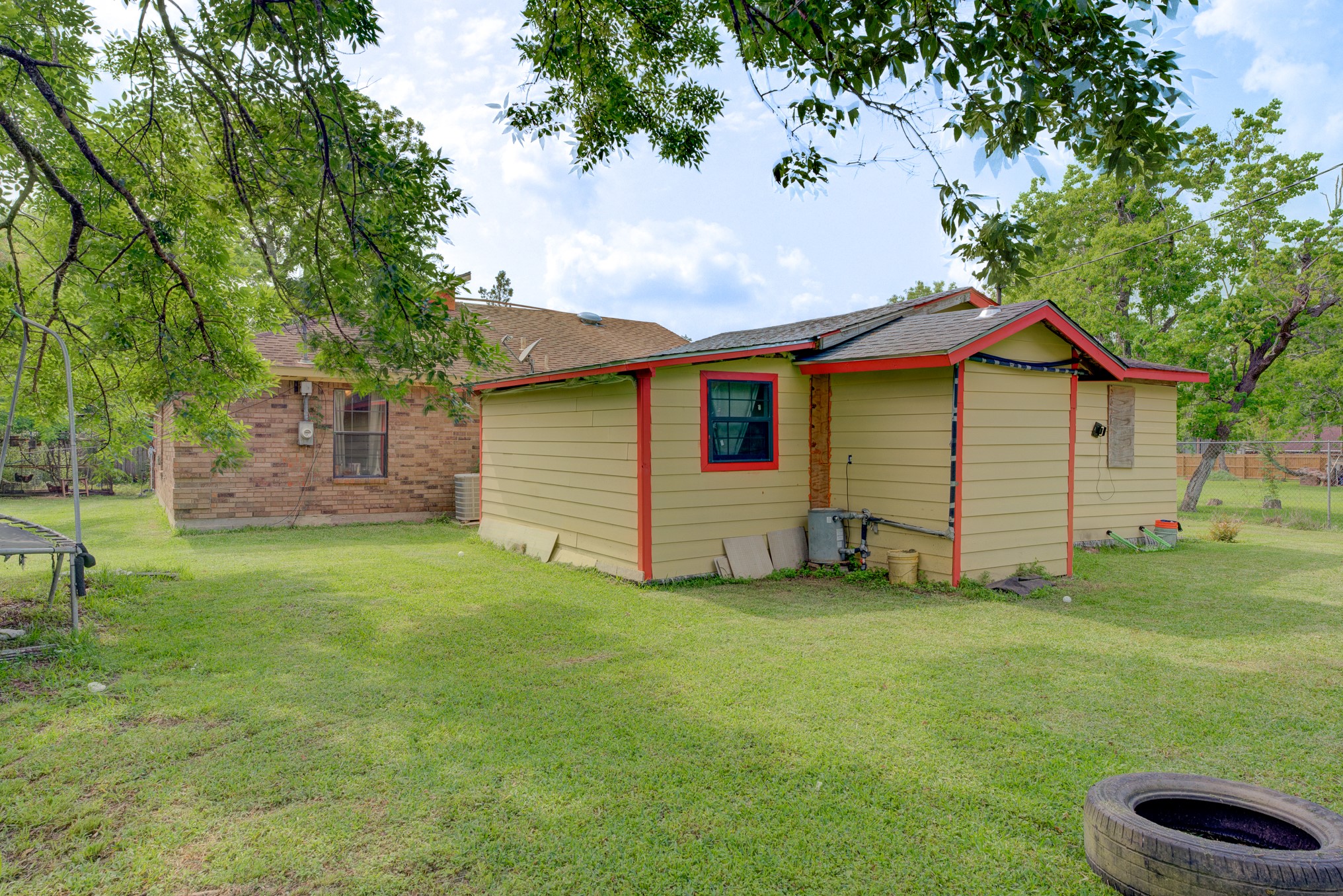 316 Hickman Lane Angleton, TX 77515 - Photo 47 of 48 a backyard of a house with table and chairs