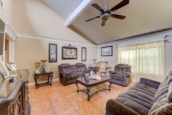 a living room with furniture and a large window