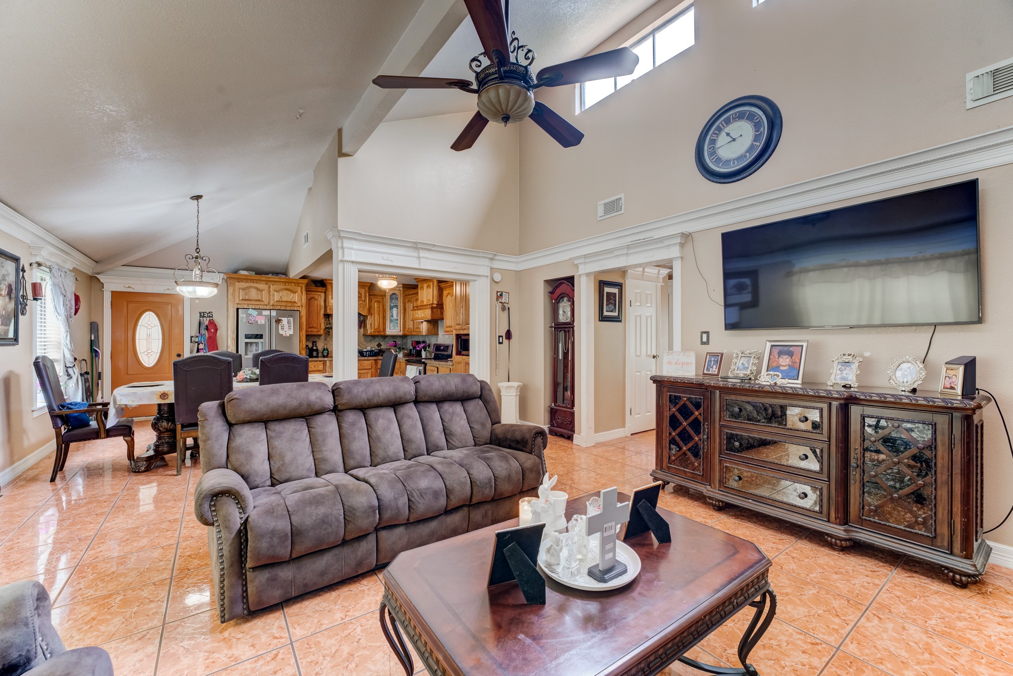 316 Hickman Lane Angleton, TX 77515 - Photo 8 of 48 a living room with furniture a flat screen tv and kitchen view