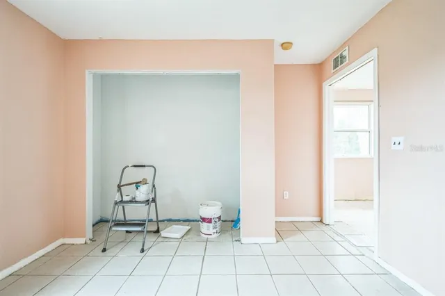 a living room with lots of furniture and a flat screen tv