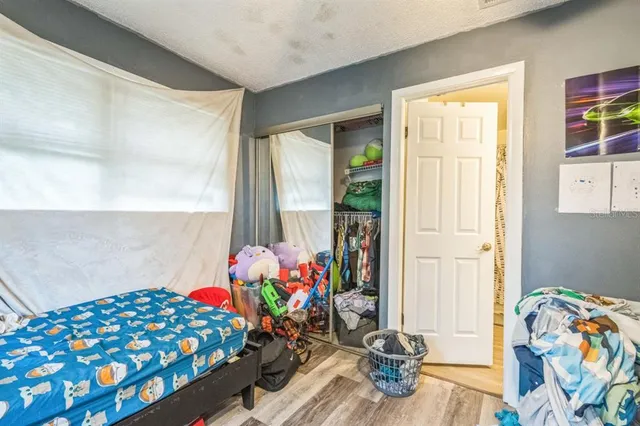 a bedroom with a bed and furniture