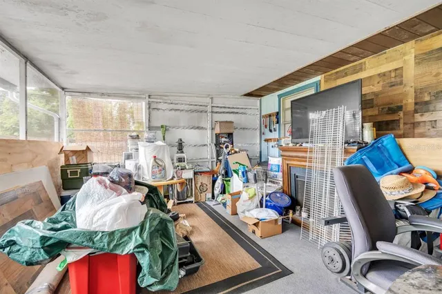 a living room filled with furniture and a wooden floor