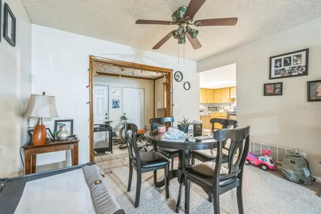 a kitchen with granite countertop a sink stove and cabinets