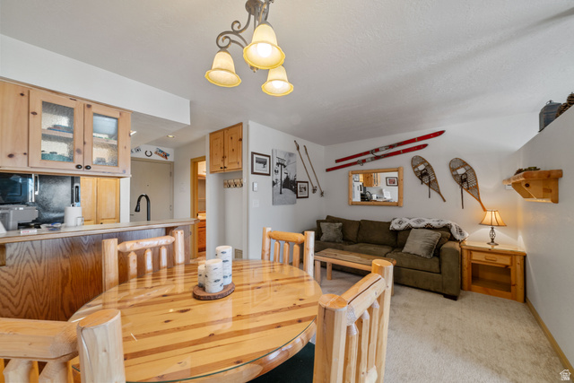 150 Ridgeview Street, Unit 117 Brian Head, UT 84719 - Photo 18 of 20 Dining room featuring light carpet