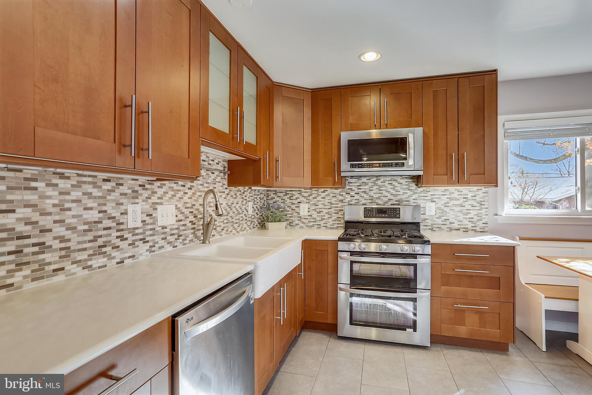 11309 College View Drive Silver Spring, MD 20902 - Photo 11 of 34 Quartz countertops and tiled backsplash