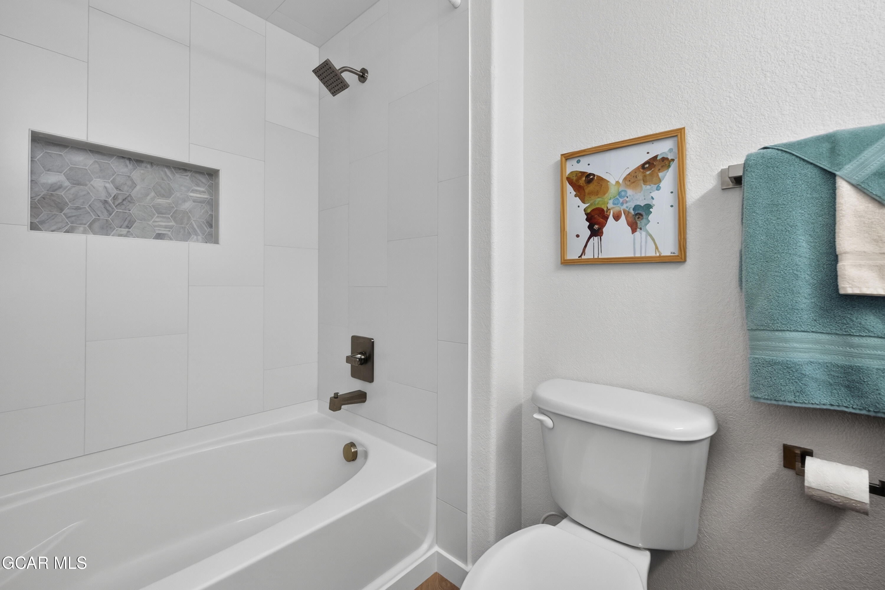 160 Village Road, Unit F207 Granby, CO 80446 - Photo 17 of 28 a white toilet sitting next to a bath tub
