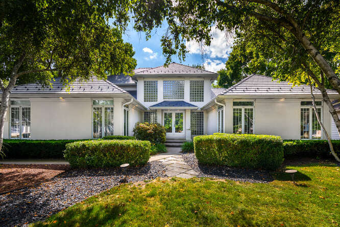 2255 Palmer Circle Naperville, IL 60564 - Photo 1 of 1 a front view of a house with a garden