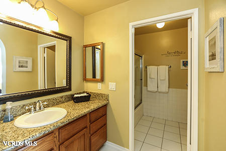 4854 Avedon Road Moorpark, CA 93021 - Photo 14 of 26 a bathroom with a granite countertop sink and a mirror