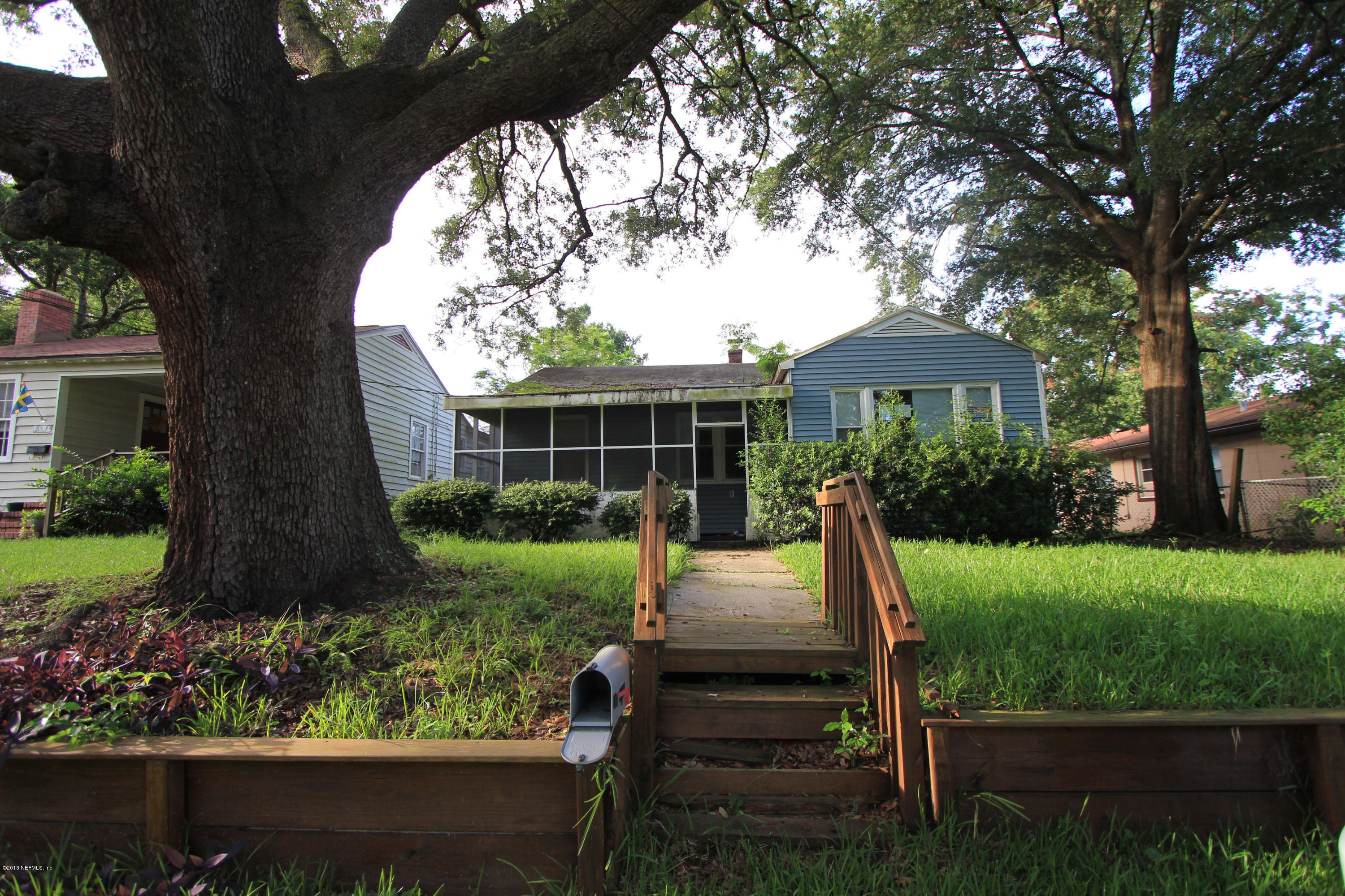 5209 Birkenhead Road Jacksonville, FL 32210 - Photo 1 of 19 a view of a house with backyard sitting area and garden