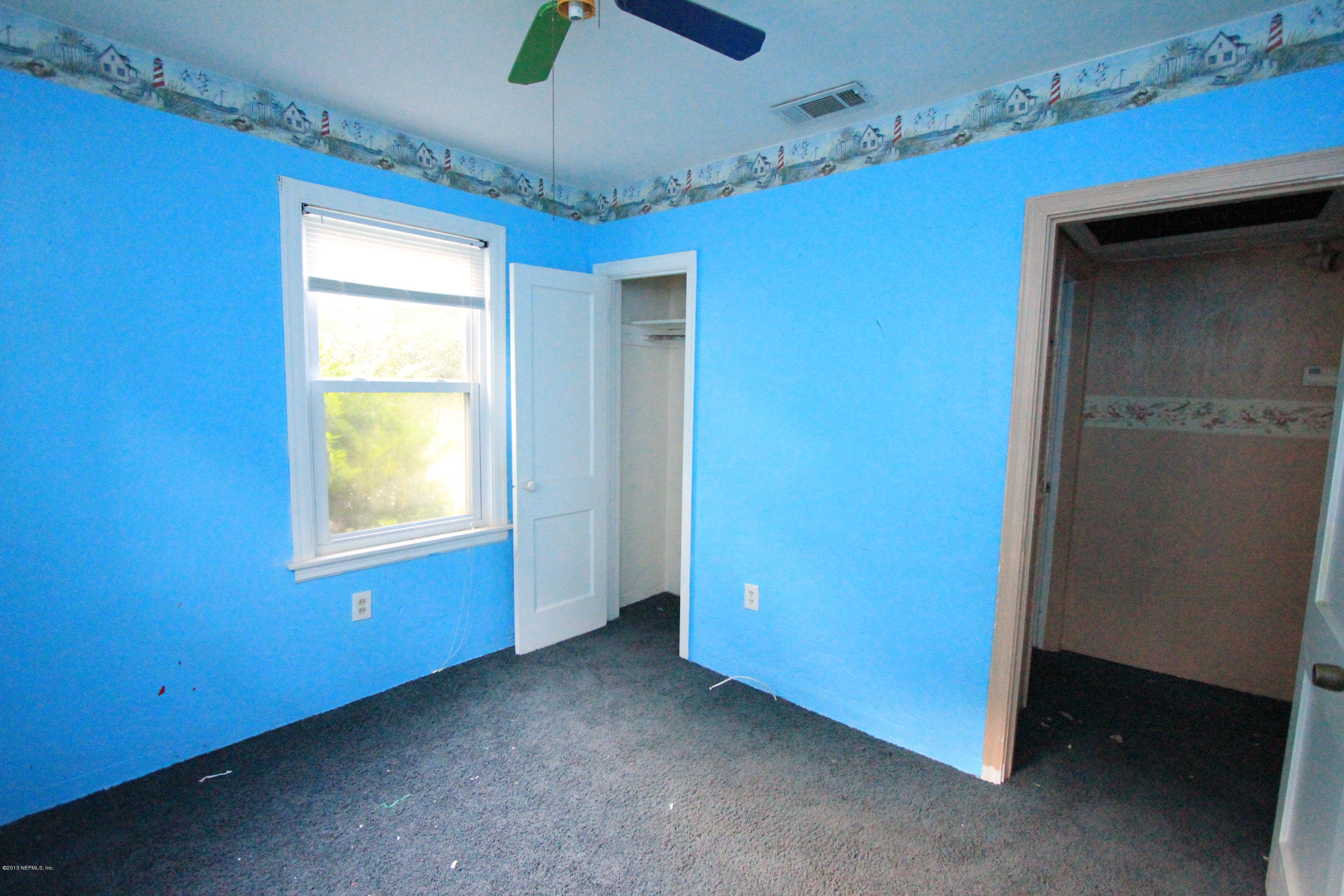 5209 Birkenhead Road Jacksonville, FL 32210 - Photo 11 of 19 a view of an empty room with a window