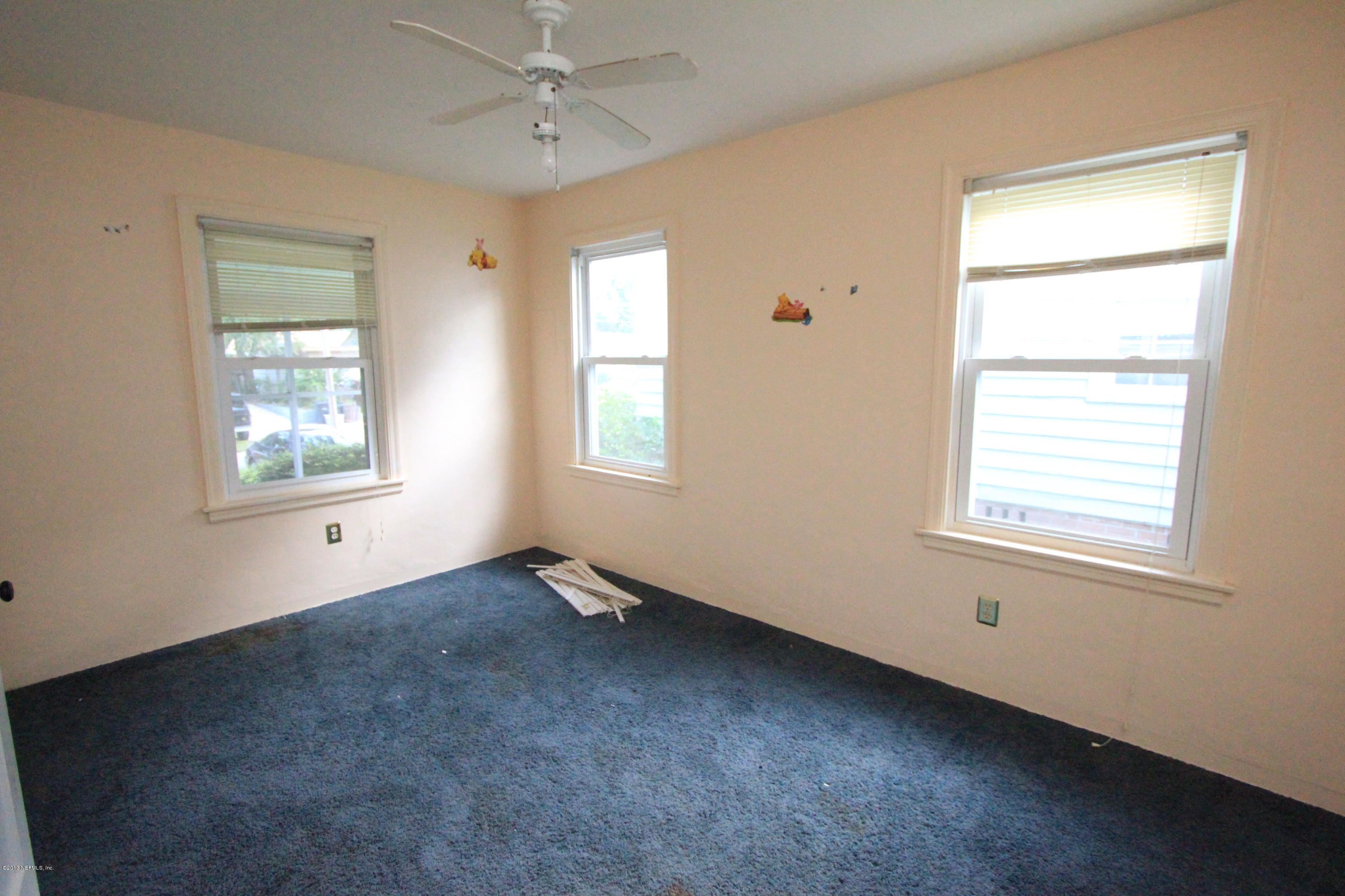 5209 Birkenhead Road Jacksonville, FL 32210 - Photo 12 of 19 a view of an empty room with a window