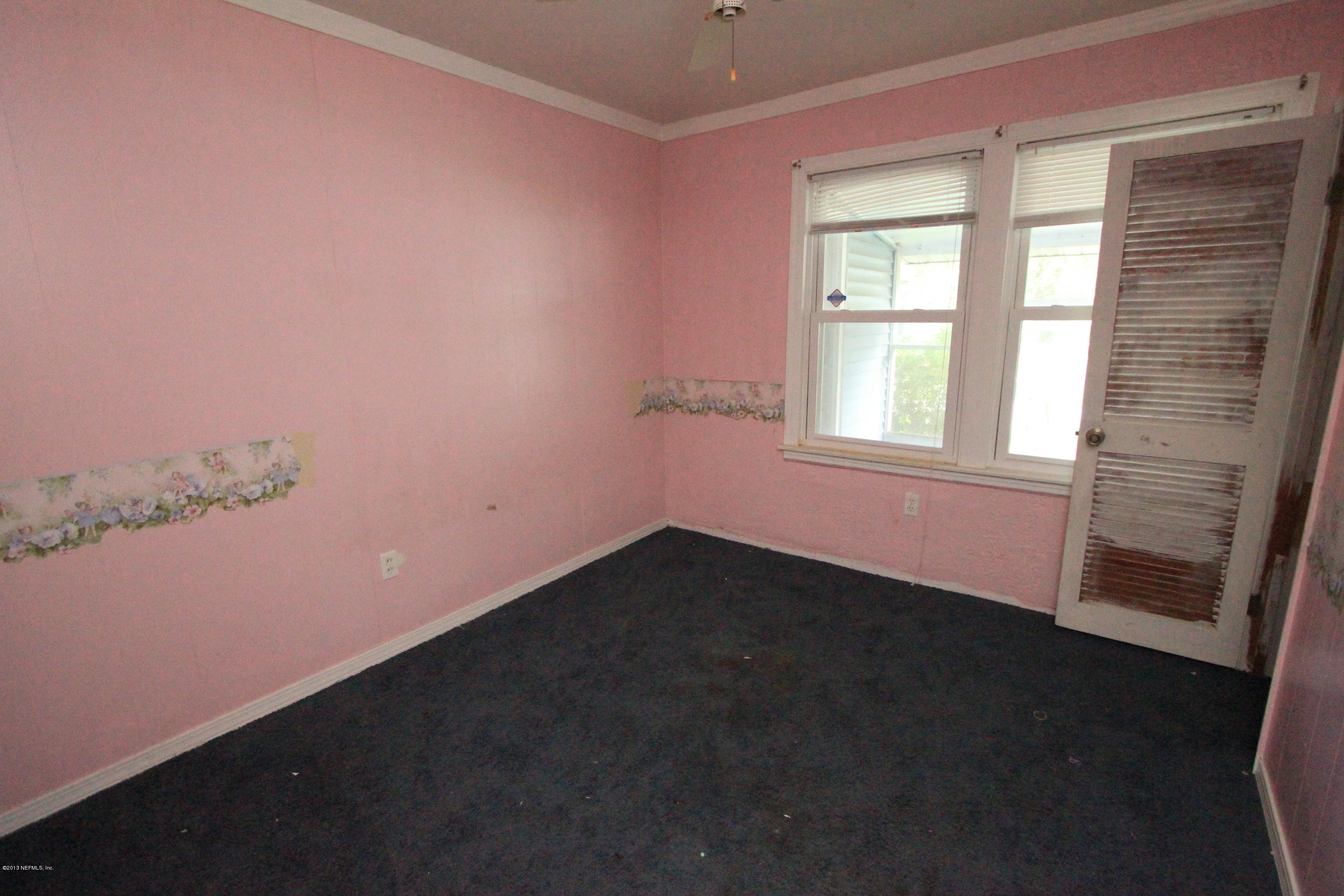 5209 Birkenhead Road Jacksonville, FL 32210 - Photo 13 of 19 a view of an empty room with a window