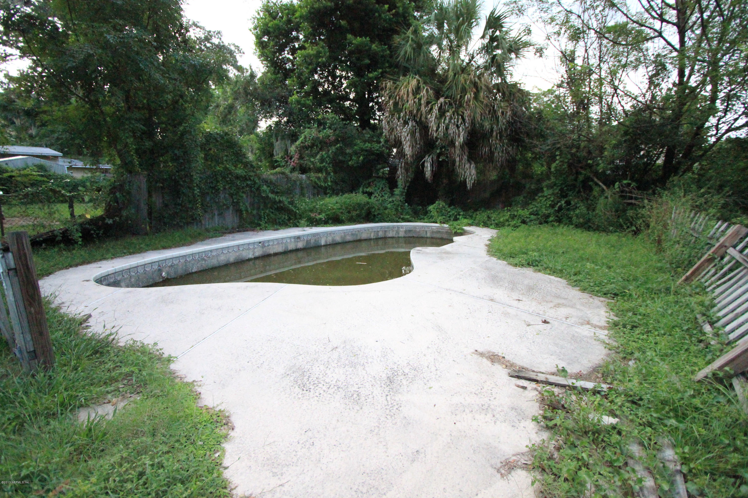 5209 Birkenhead Road Jacksonville, FL 32210 - Photo 18 of 19 a view of a swimming pool with a yard