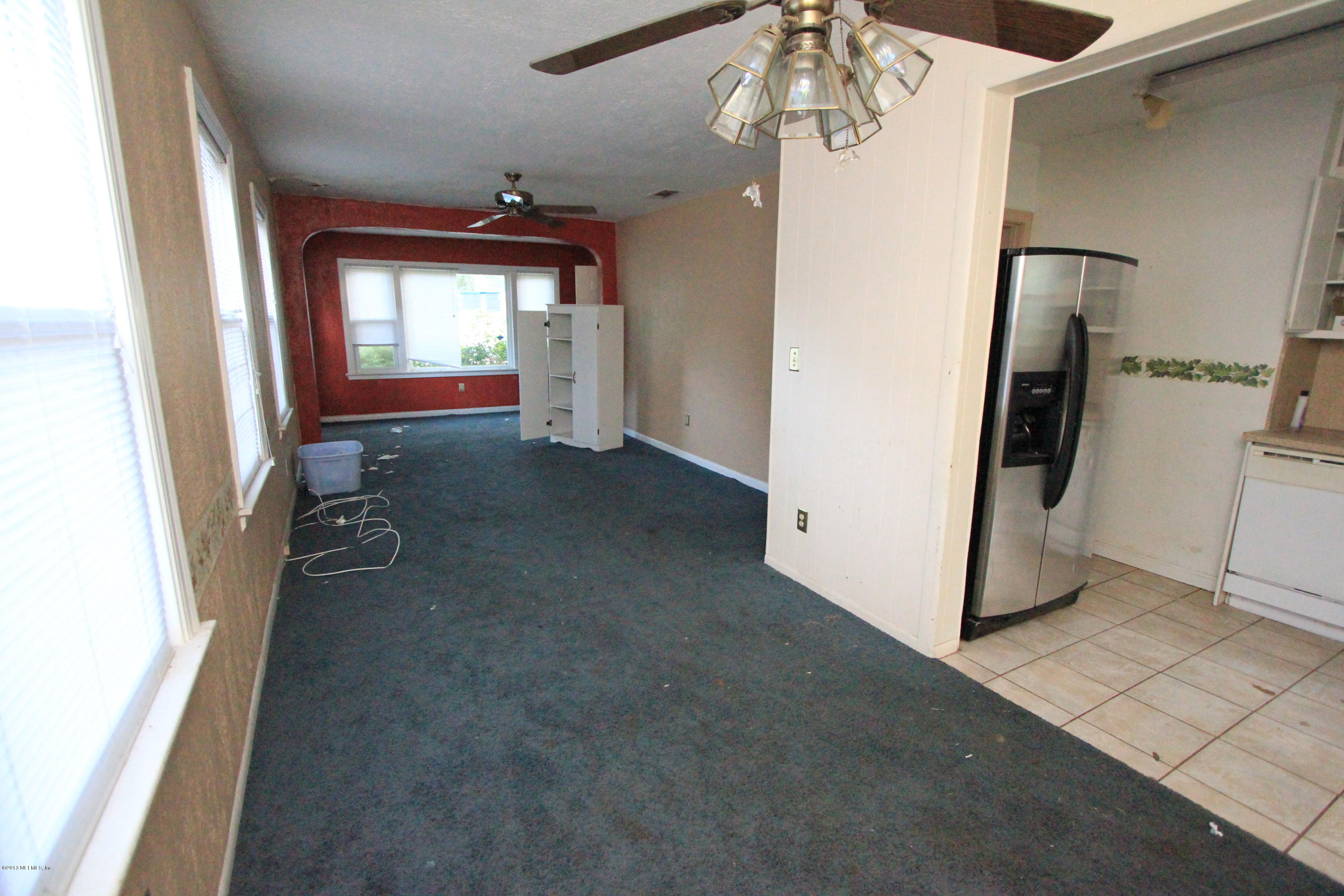 5209 Birkenhead Road Jacksonville, FL 32210 - Photo 8 of 19 wooden floor in an empty room with a window