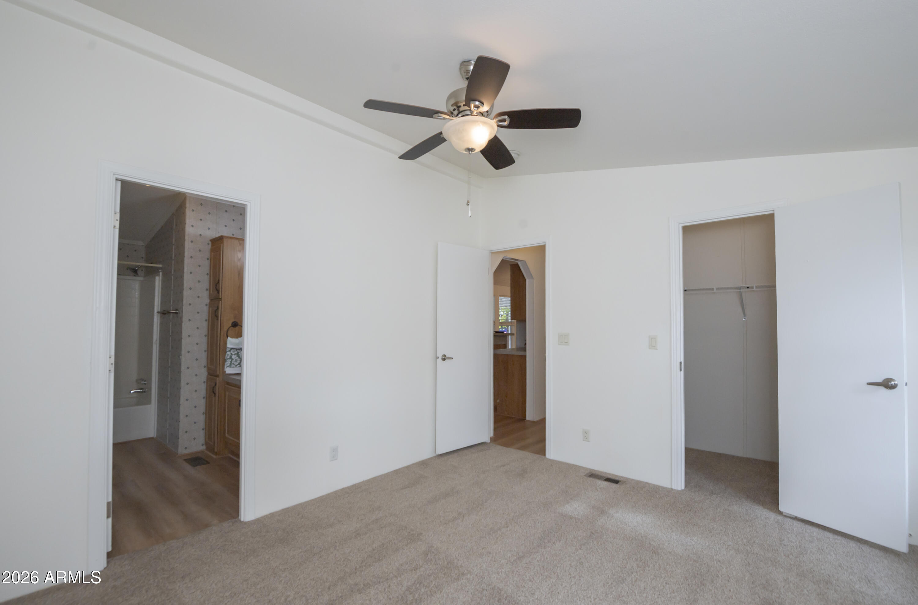 11250 East State Rte 69, Unit 1125 Dewey, AZ 86327 - Photo 20 of 45 a view of empty room with ceiling fan