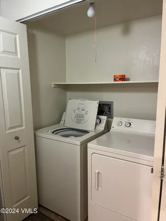a bathroom with a shower curtain and a sink
