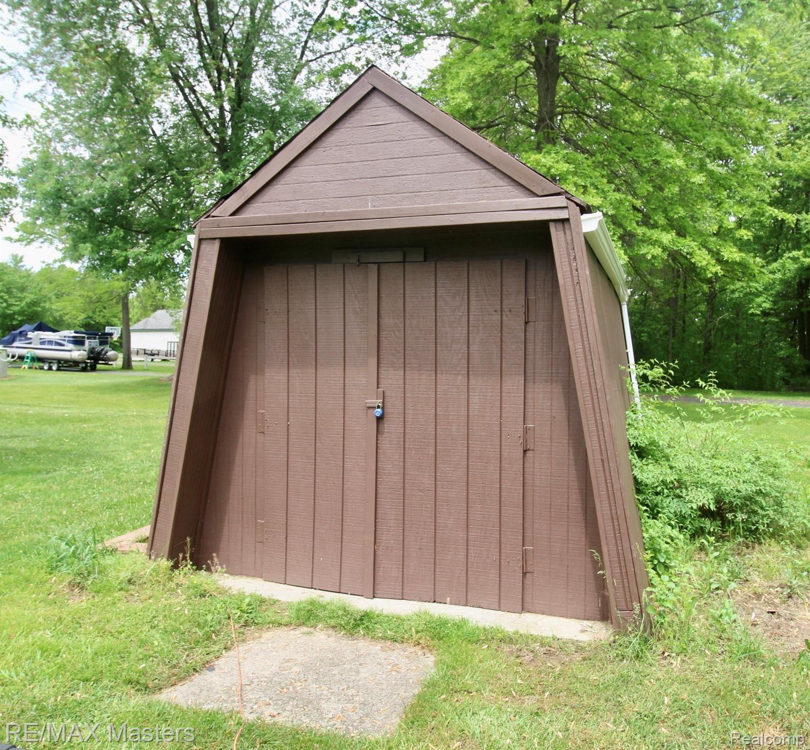 25777 Inkster Road Flat Rock, MI 48134 - Photo 44 of 52 Separate A frame storage building offers a second spot for outdoor storage