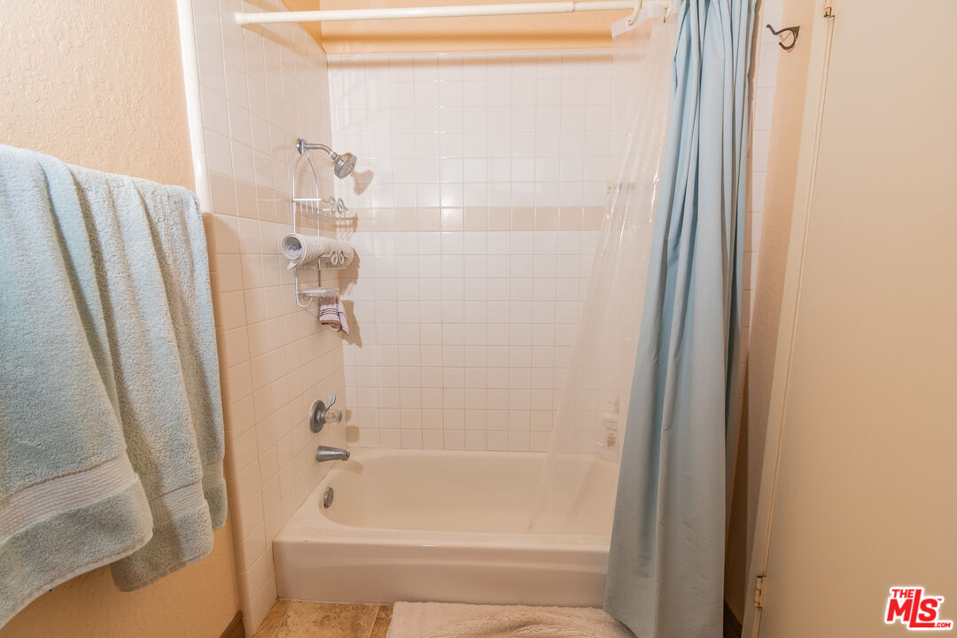 2633 Klamath Court Riverside, CA 92503 - Photo 22 of 47 a bathroom with a shower and a tub