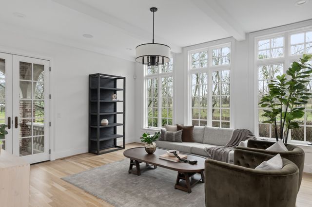 a living room with furniture and a window