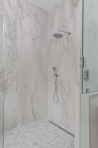 a white bath tub sitting in a bathroom
