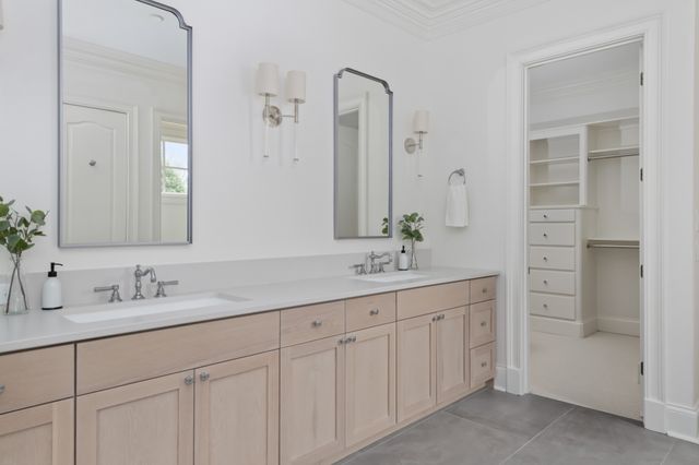 a view of walk in closet and empty racks