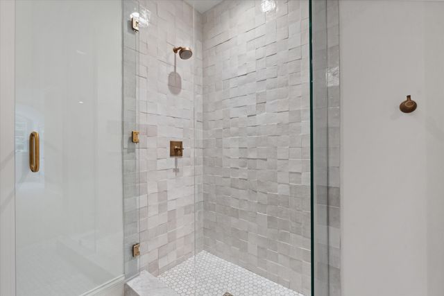 a room with gym equipment and a rug