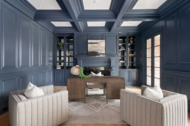 a living room with furniture a window and a fireplace