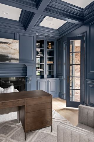 a living room with furniture cabinets and a flat screen tv