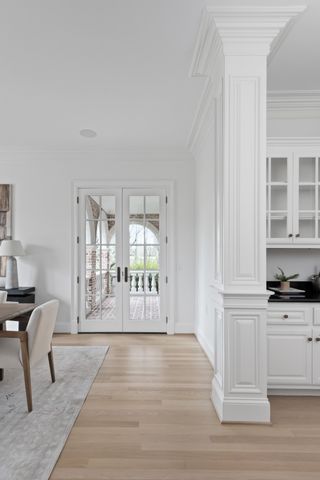 a view of a room with wooden floor and chair